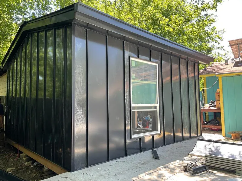 Black standing seam metal wall panels for Roof Inspection in Fort Walton Beach