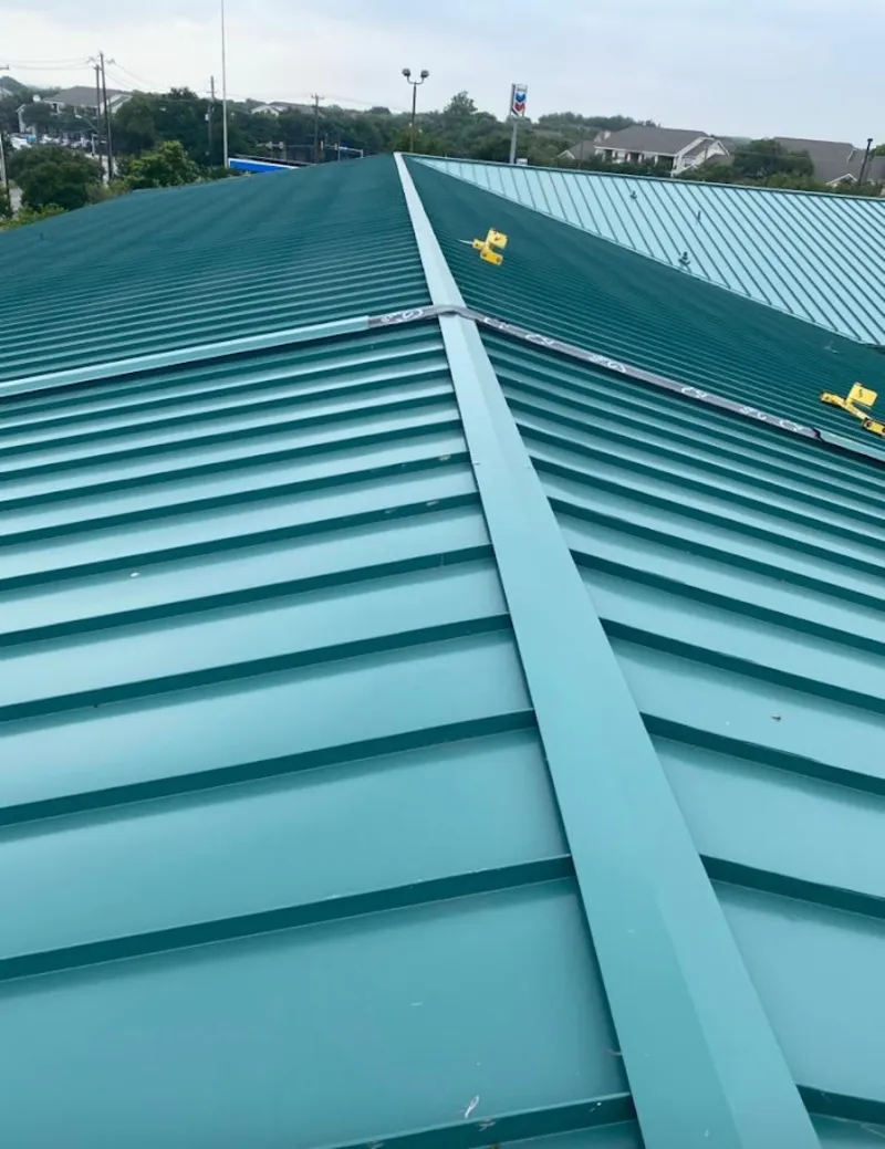 Green commercial metal roof ridge and valley for Metal Roof Repair in Fort Walton Beach