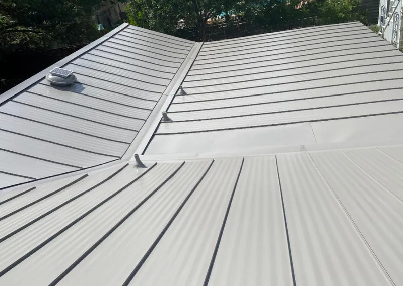 Solar attic fan installed on a metal roof for Roof Ventilation in Fort Walton Beach
